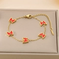 Detail of gold butterfly bracelet with red enamel charms and adjustable steel chain - Red (KB187208-BI)
