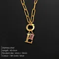 Elegant 14K gold plated stainless steel letter L necklace featuring a pink crystal - Letter L