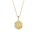 Minimalist gold stainless steel hexagon necklace featuring an embossed letter U pendant - Letter U