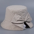 Detail of a Japanese style checkered bucket hat with a decorative bow for summer sun protection - M (56-58cm) / Beige
