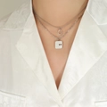 Collana doppia a strati argento con ciondolo quadrato inciso 'YOU & ME' da donna chic - Color Acciaio