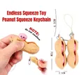 Peanut fidget toy keychain with squeeze function and pink expression ball detail - Squeeze Peanut (OPP Bagged / With Rope Chain)