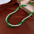 Elegant layered necklace with white pearls and green glass beads on textured fabric - White Pearl/Translucent Green Beads