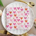 Square party napkins with pink and orange heart patterns on a white lace plate - Heart Pattern (1086)