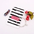 Silver bead bracelet with spherical pendant on a stylish striped gift bag - No. 3 (B&W Stripes)