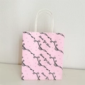 Pink paper gift bag with black bow patterns and Bowtie Girl Heart text design - Pink Bowtie Pattern Design