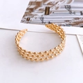 Elegante bracciale rigido dorato con design a tre file di perline lucide riflettenti - Oro