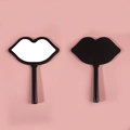 Lip-shaped handheld makeup mirror in black finish showing front and back views - 12*16 Black