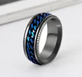 Close-up detail of black titanium steel ring with a rotatable blue chain link center - Size 7 / Black Band with Blue Chain