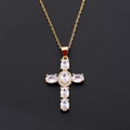 Macro shot of gold cross necklace with oval-shaped sparkling zircon stones on black background - Pendant Only / White