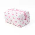 Quilted makeup bag featuring pink bow pattern with zipper closure for storage - Pink Bow Style 1