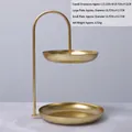 Modern two-tier golden metal snack stand for fruit and candy display on living room table - Gold