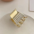 Square gold alloy hair claw clip with sparkling rhinestones in a minimalist tray - Excavator Claw Rhinestone-Gold