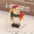 Resin snowman figurine wearing red hat and green scarf holding a red heart 6.5cm - Snowman with Heart