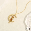 Macro shot of 18K gold plated moon cat pendant with sparkling resin and fine stone - Golden Temperature Sensing Color Changing Cat Moon (NE2147-A-1)