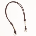 Close-up of adjustable brown leather bag strap with golden metal rings and knotted details - Gold Ring Buckle / Dark Coffee