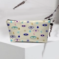 Detail of waterproof makeup bag with evil eye patterns and high-quality black zipper - Beige Evil Eye Teardrop
