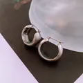 Detailed macro view of brushed silver hoop earrings with engraved minimalist branding - Silver Brushed Matte Hoop (12#)