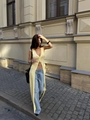Slim fit long yellow knit cardigan with buttons styled with denim on a city street - Yellow