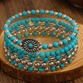 Detail of bohemian turquoise beaded bracelet set with vintage engraved metal pendant - Antique Silver Turquoise Wrap Beads (X395)