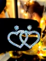 Sparkling silver double heart drop earrings with rhinestones held by a black glove - Colorful Silver Heart Style (DTE1516232S-WAB)
