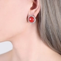 Retro round stud earring featuring a vibrant red bead with a silver twisted metal border - Steel Color Red Turquoise Earrings