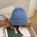 Detailed view of blue knitted beanie hat texture on minimalist wooden decor - M (56-58cm) / Sky Blue