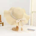 Beige wide-brim straw sun hat with wavy edges and elegant white lace bow detail - Solid Color Lace Beige