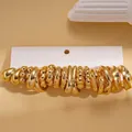 Set van 10 paar minimalistische gouden creolen met verschillende getextureerde afwerkingen - 20-delige set (10 paren) / Roestvrijstalen pin - Goud