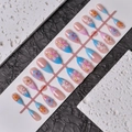 Detailed view of 3D embossed flowers and pearls on almond-shaped blue gradient nails - Wy-005 / 10 Pieces In Xs Size