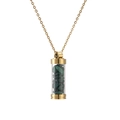 Close-up of golden stainless steel necklace with green malachite stones inside glass vial - Gold Malachite