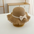 Close-up of girl straw sun hat featuring wavy brim and delicate lace bow detail - Straw Hat / Khaki