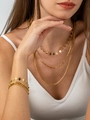 Close-up of layered gold rhombus piece, bamboo and Cuban chain necklaces on model - Necklace And Bracelet Set (ZHK1820 Gold)