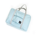 Foldable light blue travel luggage bag with front zipper pocket and grey carry handles - Light Blue