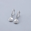 Macro shot of S925 sterling silver hoop earrings with crescent moon zircon pendant - Moon Earrings - Silver
