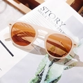 Retro cream beige sunglasses with gradient amber lenses on an aesthetic magazine - Nude Pink Frame Tea Lens