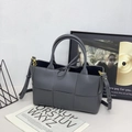 Grey woven tote bag with adjustable shoulder strap and decorative leather bow detail - Flash Grey