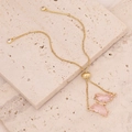 Detail of an 18K gold butterfly bracelet with pink crystals and adjustable clasp - Pink