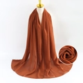 Brown pearl chiffon scarf shown on a model with a close-up texture detail and soft drape - Brown