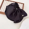 Elegant large black pleated satin hair claw clip with golden metal brand detail - Black
