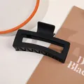 Macro detail of large matte black hair claw clip with rectangular cutout design - 13cm Rectangular - Matte Black