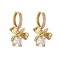 Macro detail of gold bow earrings with micro-paved diamonds and clear square crystal drops - Earrings / Gold White Zirconia