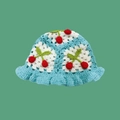 Detail of hand-knitted light blue bucket hat featuring red 3D cherries and wavy brim - One Size / Cherry Sky Blue