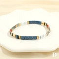 Macro shot of colorful Tila enamel tile beads on a minimalist elastic beach bracelet - Multicolor D-Dark Blue White Gold Grey Red Black