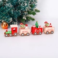 Detail of four-section wooden Christmas train featuring Santa and festive pine trees - Red 4-Section (2506-A) / Red