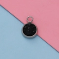 Macro shot of 12mm stainless steel pendant with black stone inlay on dual color background - Black Crushed Stone Style (12)