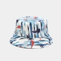 Reversible bucket hat with abstract sailboat pattern in blue, red, and white print - Abstract Sailing Pattern