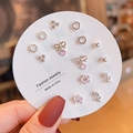Macro detail of six pairs of silver-tone Korean style stud earrings on display card - Silver Pink Heart Set (E0011-1)