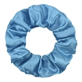 Detail of blue satin scrunchie with silky texture and elegant fabric folds - Teal