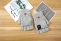 Gray knitted convertible gloves for men featuring a brown wooden button and fashion label - One Size / Gray
